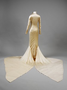 Silk_satin_wedding_dress_designed_by_Charles_James_London_1934._Worn_by_Barbara_Baba_Beaton._Given_by_Mrs_Alec_Hambro_c_Victoria_and_Albert_Museum_London_reverse-225x300